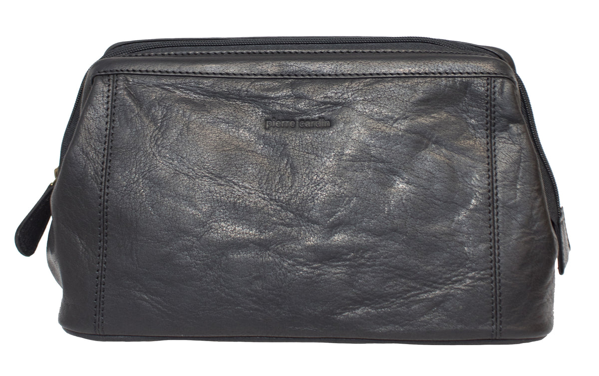 The Pierre Cardin Leather Toiletry Bag is a genuine leather toiletry bag with a rectangular shape, featuring a zip closure and a small handle on one side. The brand name "Pierre Cardin" is embossed on the front.