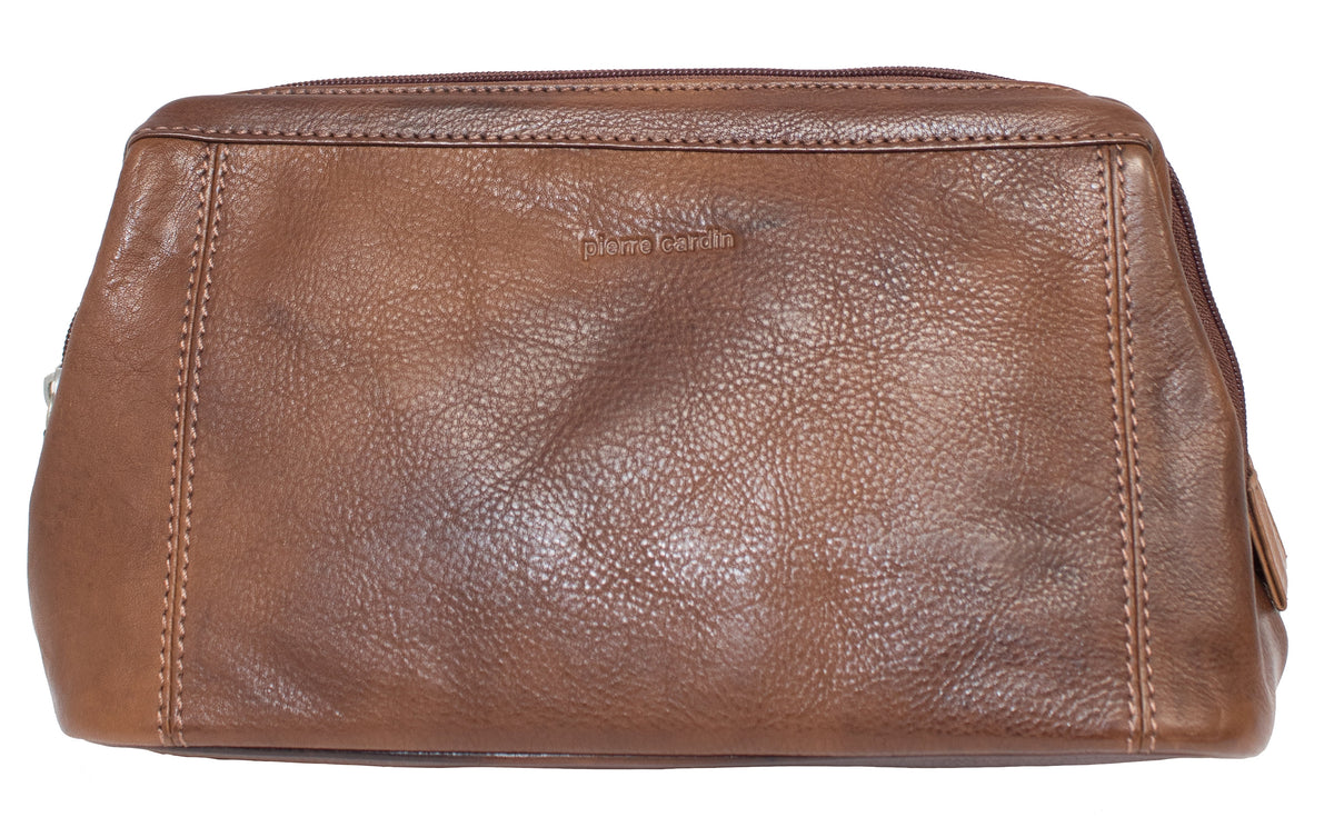 The Pierre Cardin Leather Toiletry Bag is made from brown genuine leather, showcasing a textured surface with visible stitching along the edges. It features a zipper and has "Pierre Cardin" subtly embossed on the front.