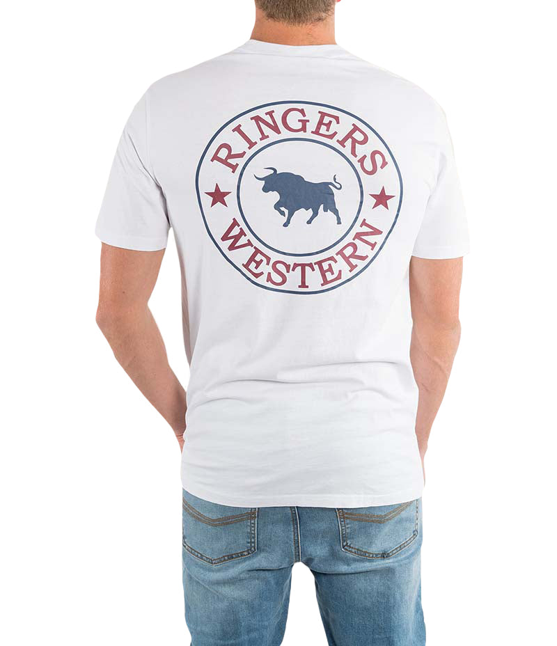The individual wears a Ringers Western Signature Bull Classic T-shirt in 100% cotton, showcasing the iconic circular bull and stars logo on the back. They pair it effortlessly with blue jeans, casually facing away from the camera.