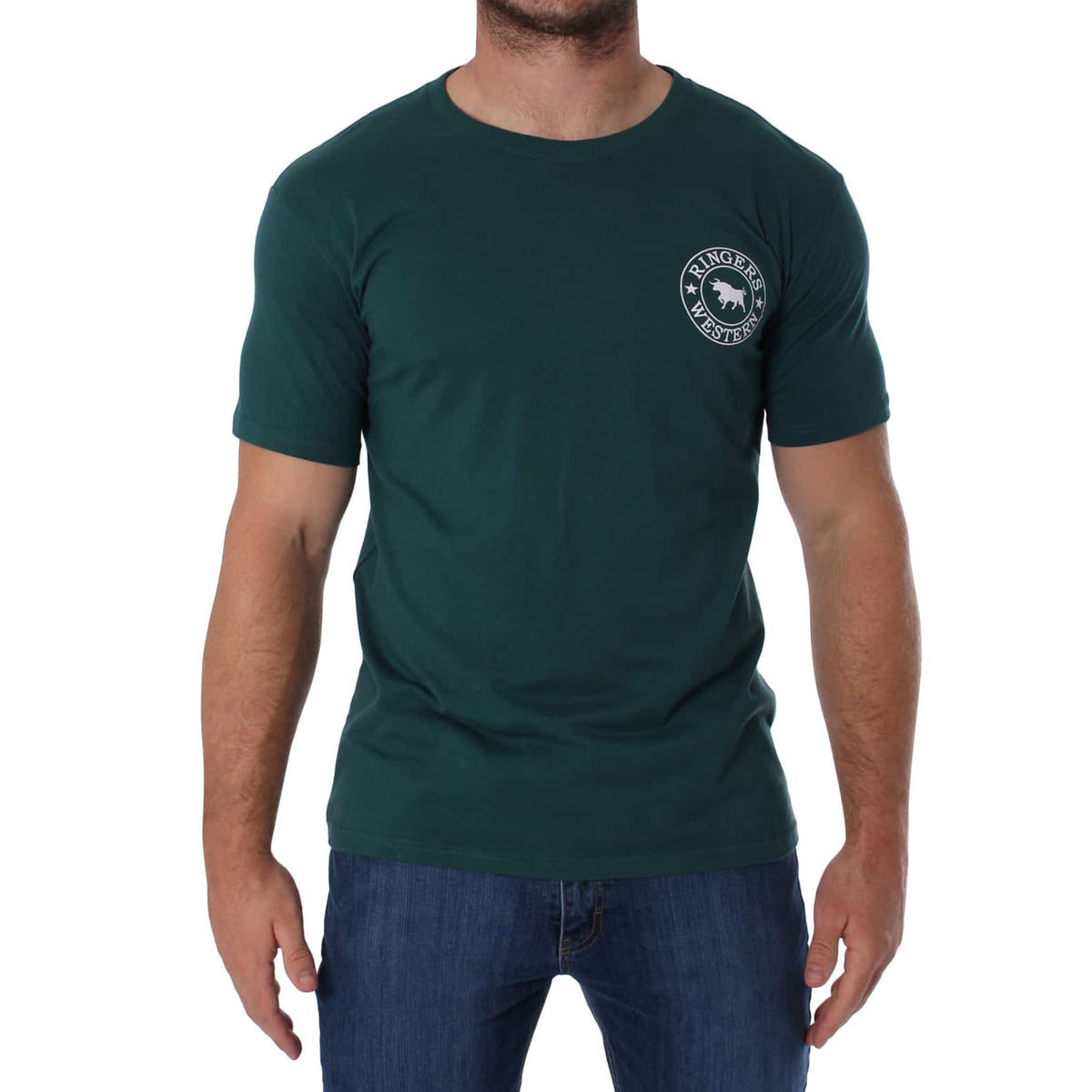 A person with short hair is wearing a dark green Ringers Western Signature Bull Classic T-Shirt, which features a crew neck and a small circular white logo with text and a graphic on the left chest. The comfortable t-shirt is paired with blue jeans, and their hands are relaxed at their sides against a plain white background.