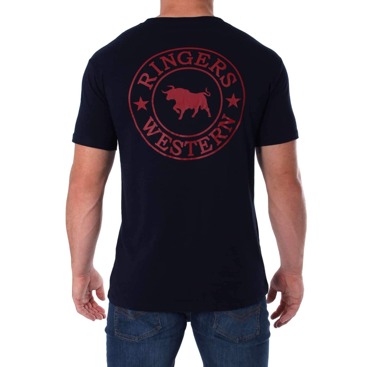 A person wearing a black Ringers Western Signature Bull Classic T-Shirt, which features a red bull and two stars in a circle on the back. The individual is facing away from the camera, and is also dressed in blue jeans.