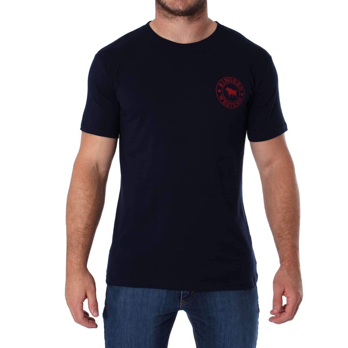 A man wearing a comfortable black Ringers Western Signature Bull Classic T-Shirt with a small red circular design featuring a moose head on the left chest area. He is also sporting blue jeans and standing against a plain white background.