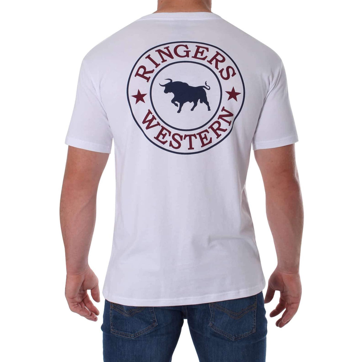 A person is sporting the Ringers Western Signature Bull Classic T-Shirt, a comfortable white crew neck featuring a black bull silhouette inside a circular emblem with red text and stars on the back. The outfit is completed with blue jeans.