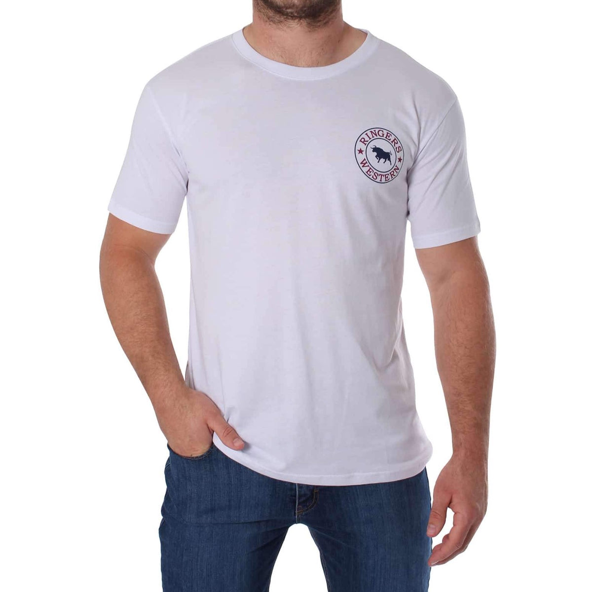 A man wearing a plain white Ringers Western Signature Bull Classic T-Shirt with a small circular emblem on the left chest area, paired with blue jeans. His right hand is in his pocket while his left arm hangs by his side. The emblem includes text and a graphic, though the details are not clear.