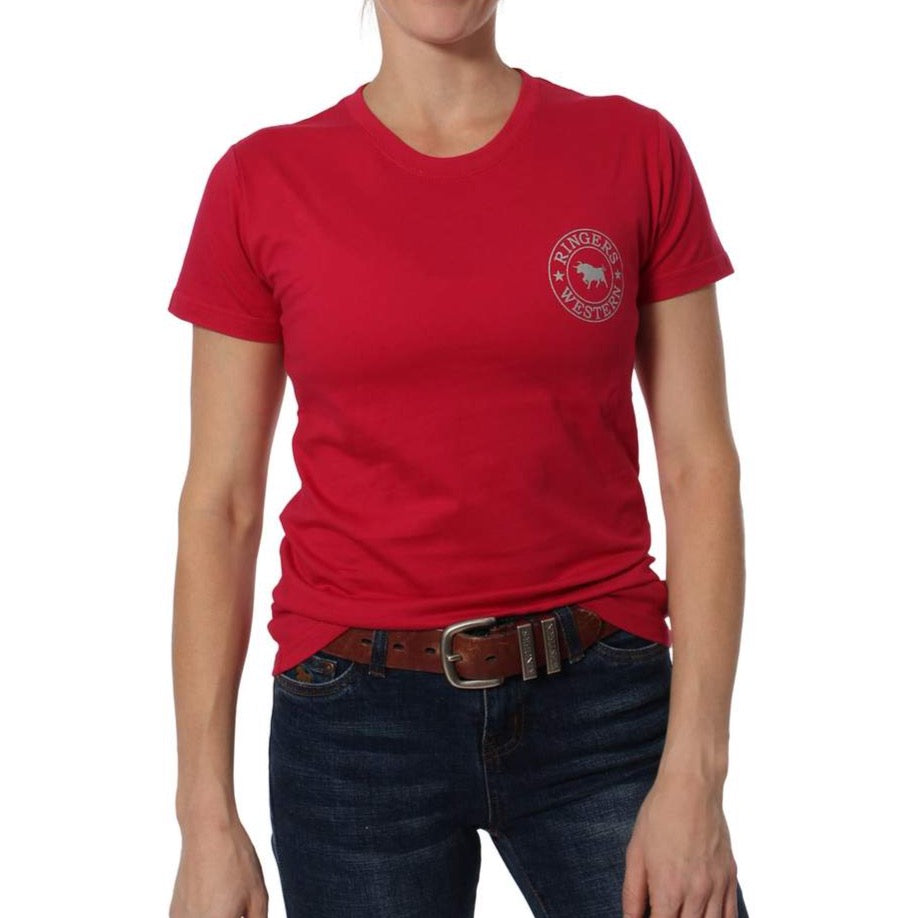 A person wearing a red Ringers Western Signature Bull Classic T-Shirt with a small circular left chest logo, paired with blue jeans and a brown belt, stands against a plain white background.
