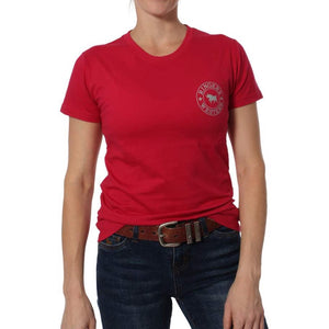 A person wearing a red Ringers Western Signature Bull Classic T-Shirt with a small circular left chest logo, paired with blue jeans and a brown belt, stands against a plain white background.