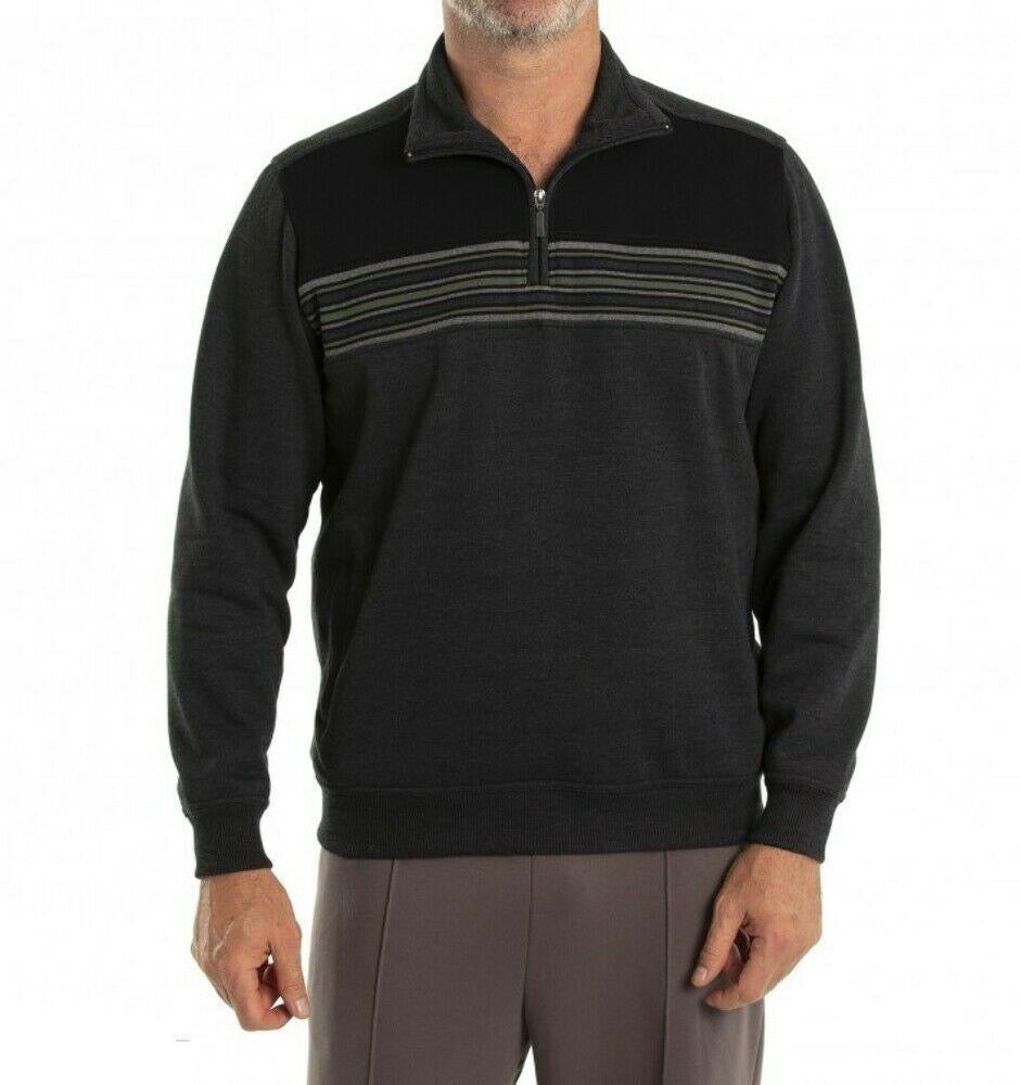 A man is wearing a dark grey Breakaway Dex Snowy Mt Fleece Half Zip pullover with a half-zip collar and striped detail across the chest. He is also wearing light grey pants. The cozy fleece pullover has long sleeves, and his left hand is partly visible in the image. The background is plain white.