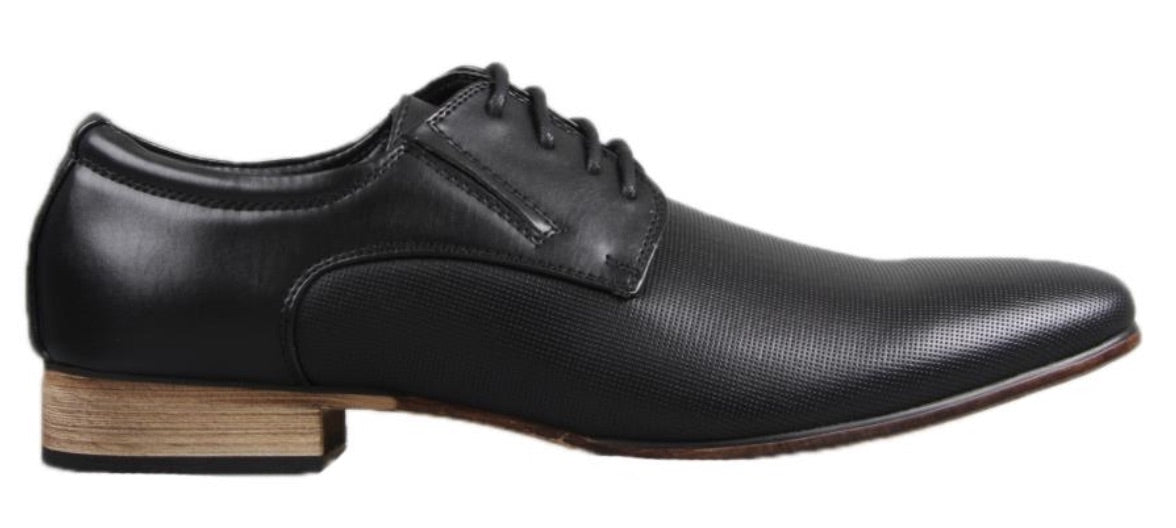 The UNcut Charles Shoe is a black men's lace-up dress shoe with elegant textured detailing and a sleek wooden heel. It features a lace-up closure with three eyelets and boasts a smooth, polished leather-like finish. Available in UK sizing, this shoe is perfect for formal occasions.