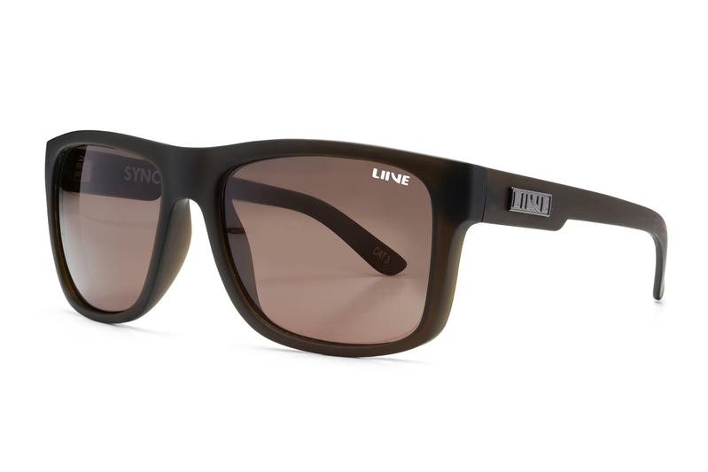 The Liive Sync Sunglasses are black rectangular shades featuring dark tinted, optically correct lenses. The sleek and lightweight polycarbonate arms have the word "LINE" printed on the inner side, with one arm showcasing a metallic logo near the hinge. These modern and stylish sunglasses provide excellent UV protection.