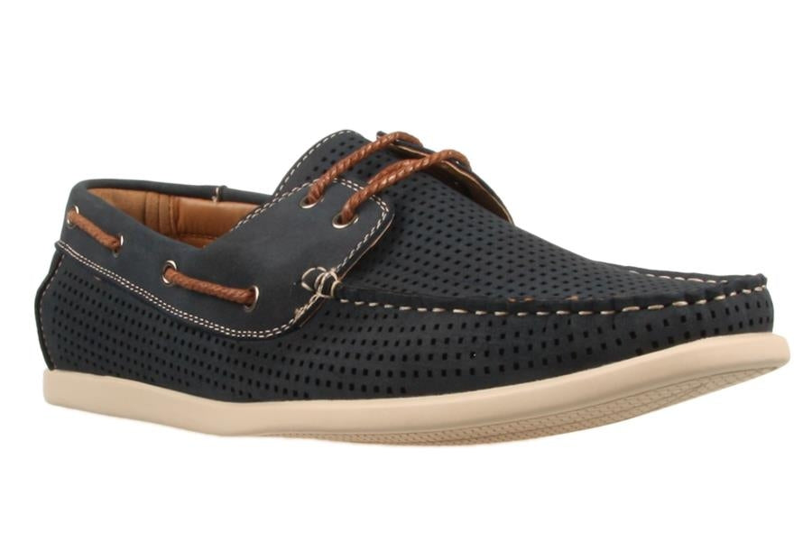 The UNcut Maya Shoe is a single black perforated loafer with white stitching and brown leather laces. It features a perforated upper, a white sole, and contrasting light brown interior lining. This men's lace-up boat shoe is casual yet stylish, suitable for both informal and semi-formal occasions.
