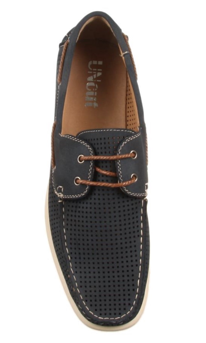 A top view of the UNcut Maya Shoe, a single black leather men's lace-up boat shoe featuring brown laces, white stitching, and a perforated upper. The shoe boasts a tan interior lining and light-colored sole. The brand name "U.S. Polo Assn." is visible inside the shoe. Note: UK sizing applies to this stylish footwear option.