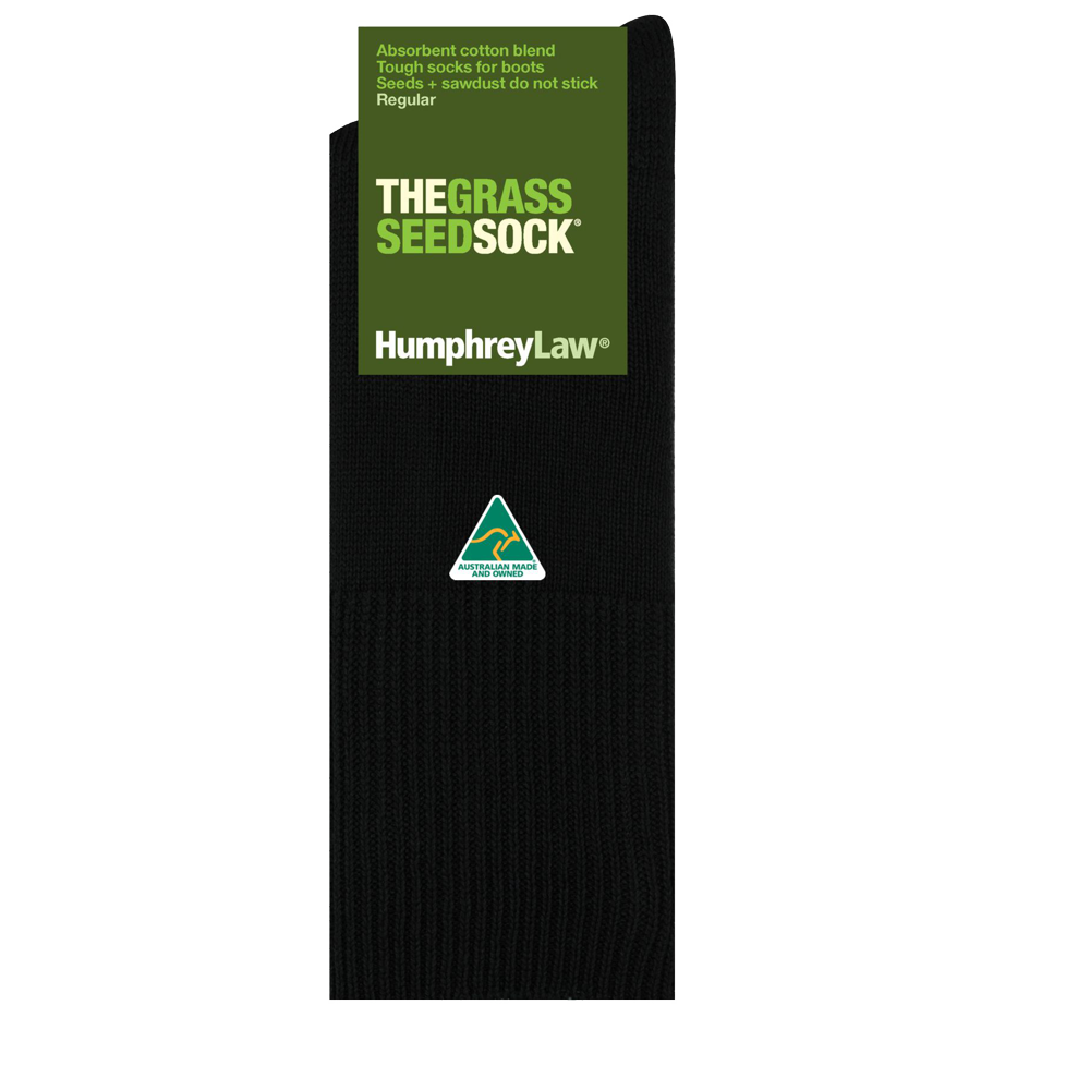 A pair of black socks, identified as the "Humphrey Law Grass Seed Sock - Short," is displayed against a white backdrop. These Australian-made socks feature packaging that reveals they are crafted from an absorbent cotton blend designed to prevent grass seed and sawdust from adhering.