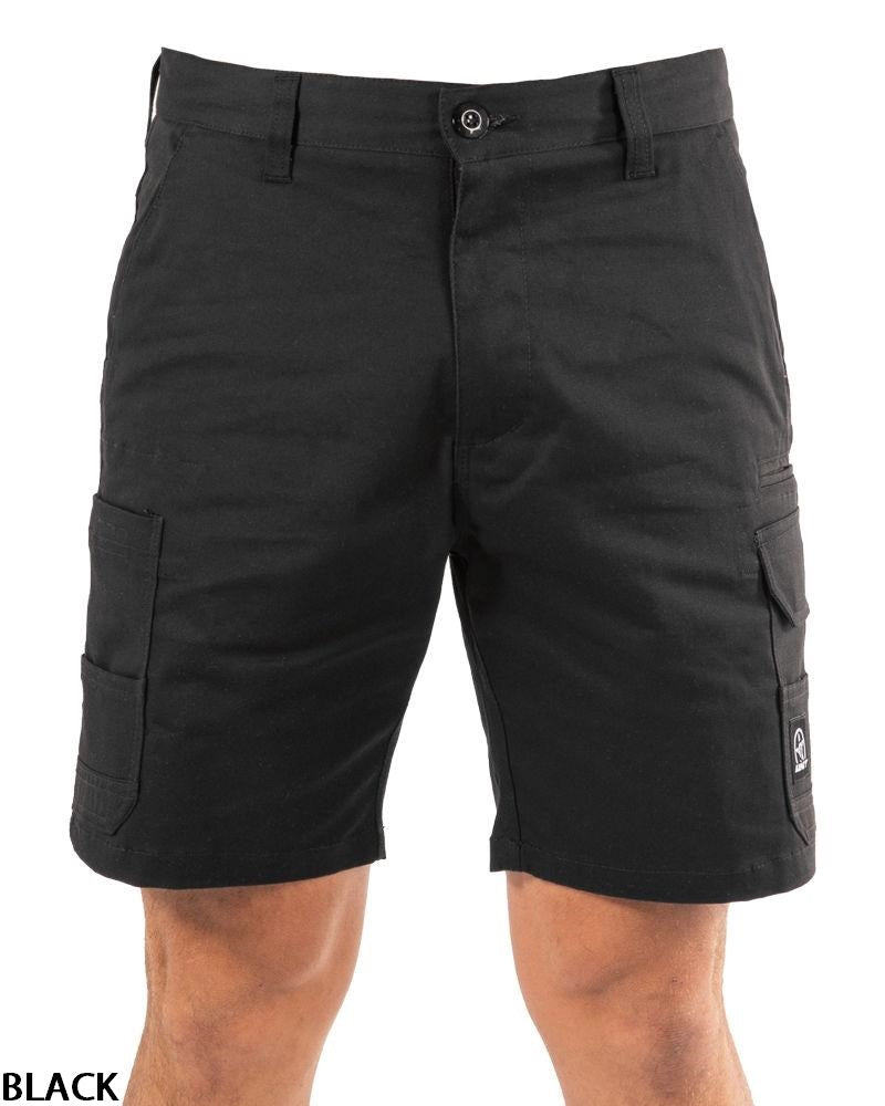 A person wearing UNIT Demolition Stretch Cargo Shorts made from durable stretch fabric with button-closure cargo pockets and a small logo patch on the lower right pocket; only the shorts and part of their legs are visible.